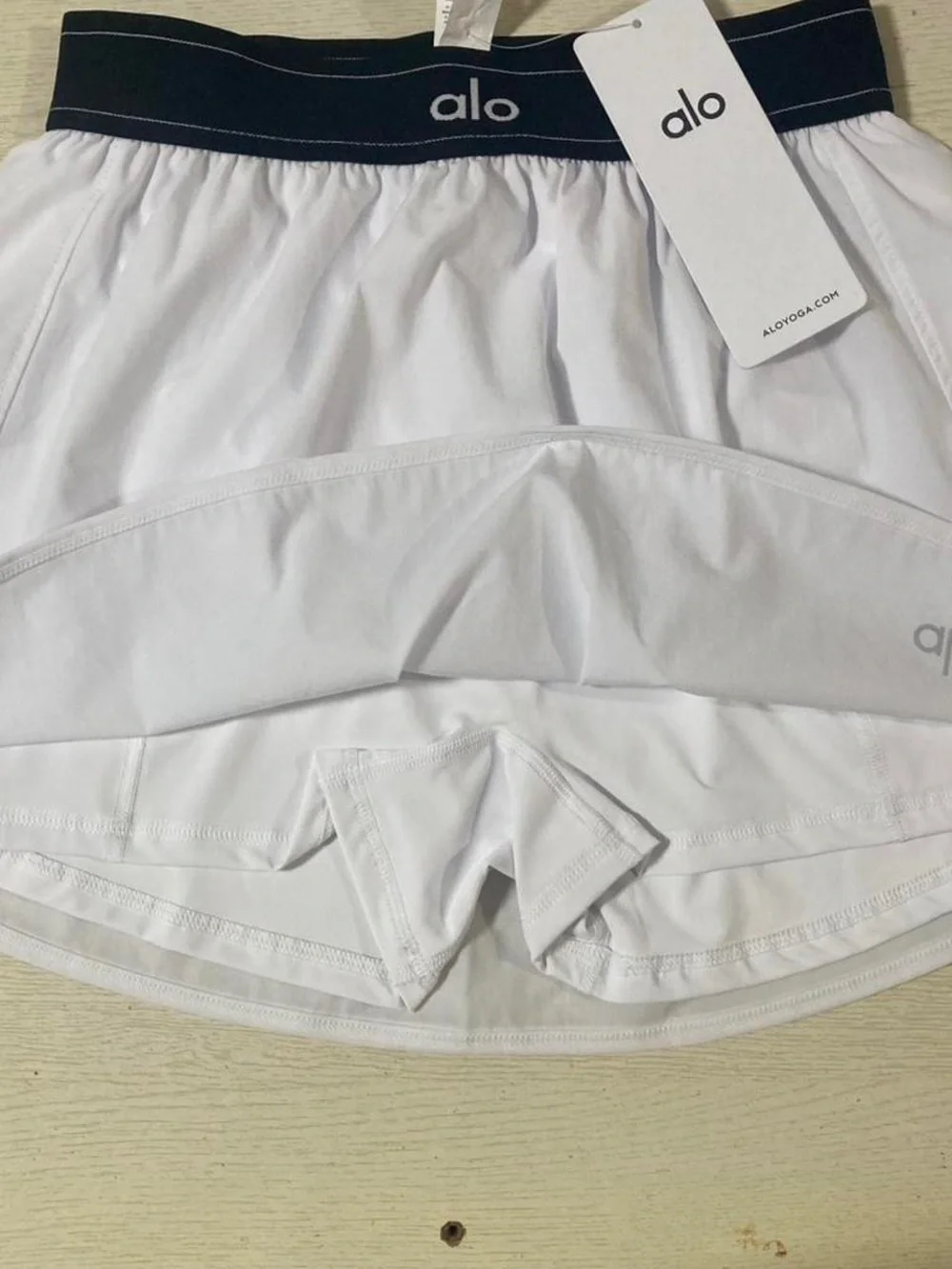 ALO Yoga White Circle Skater Skirt with Black Elastic Waistband